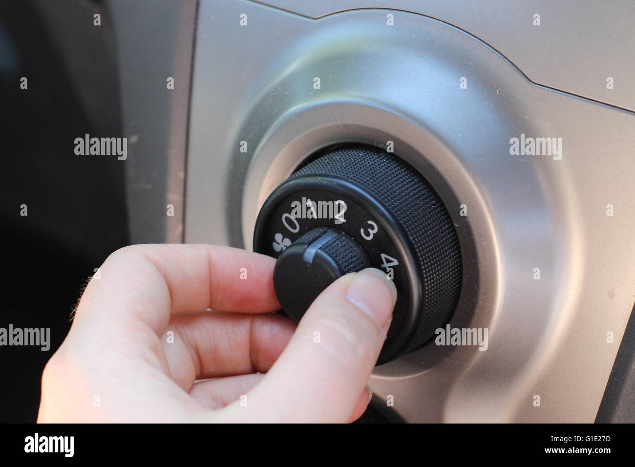 Adjusting the car fan Stock Photo - Alamy
