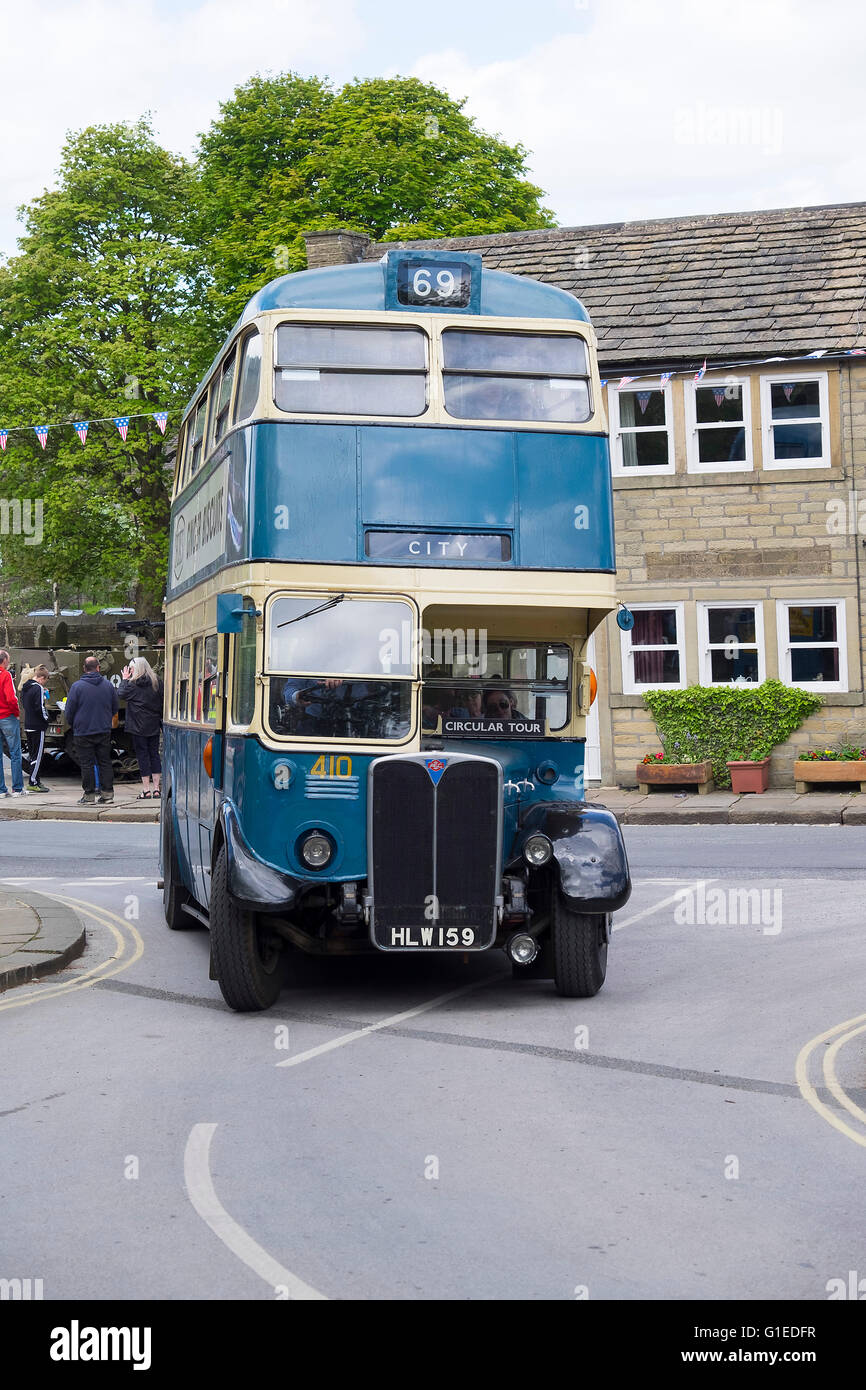 Haworth, Yorkshire, UK. 14th May, 2016. The village of haworth, west yorkshire, is transformed for the annual 1940’s weekend. Sunny weather filled the streets and vintage buses carried tourists. Credit:  Light-Phase Photography/Alamy Live News Stock Photo