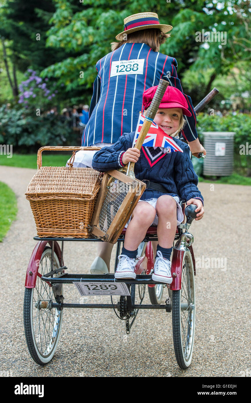 London, UK. 14th May, 2016. A family on a three man bike and tricycle in matching blazers - The Tweed Run, a very British public bicycle ride through London’s streets, with a prerequisite that participants are dressed in their best tweed cycling attire. Now in it's 8th year the ride follows a circular route from Clerkenwell via the Albert Memorial, Buckinham Palace and Westminster. Credit:  Guy Bell/Alamy Live News Stock Photo
