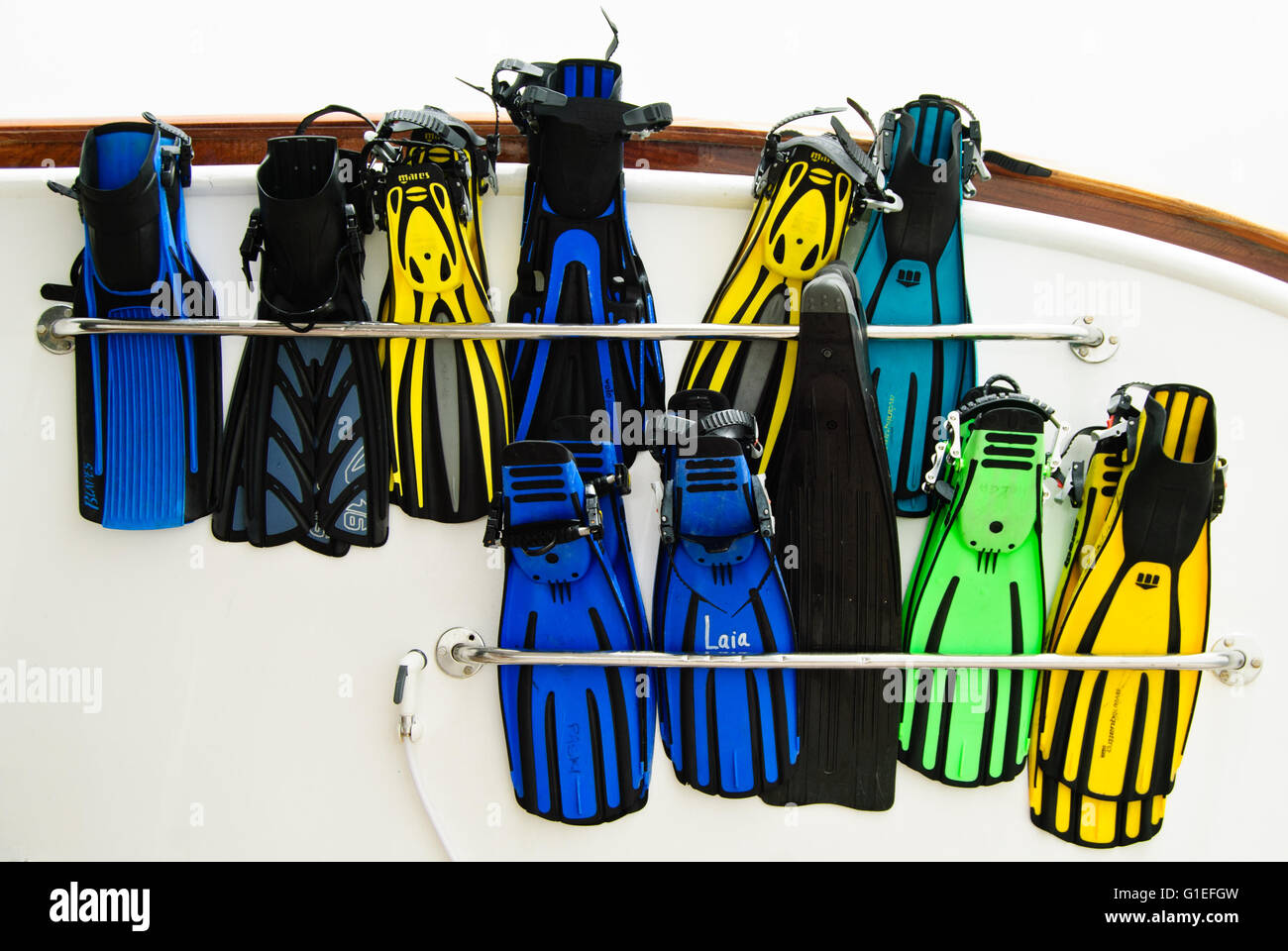 Colourful diving fins on a live-aboard boat. Stock Photo