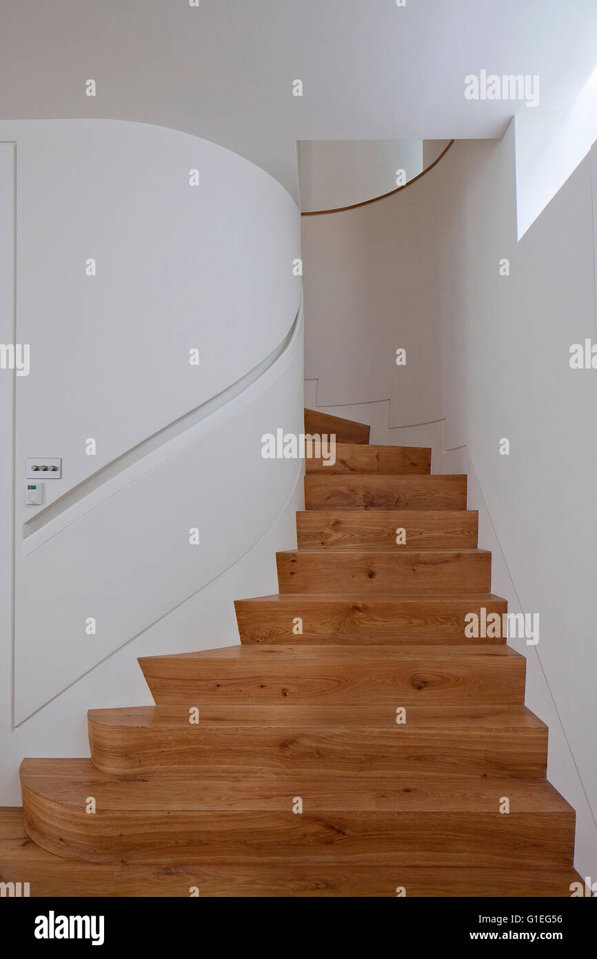 Modern Family home, Shepherds Bush, London. Spiral wood staircase and white walls. Stock Photo