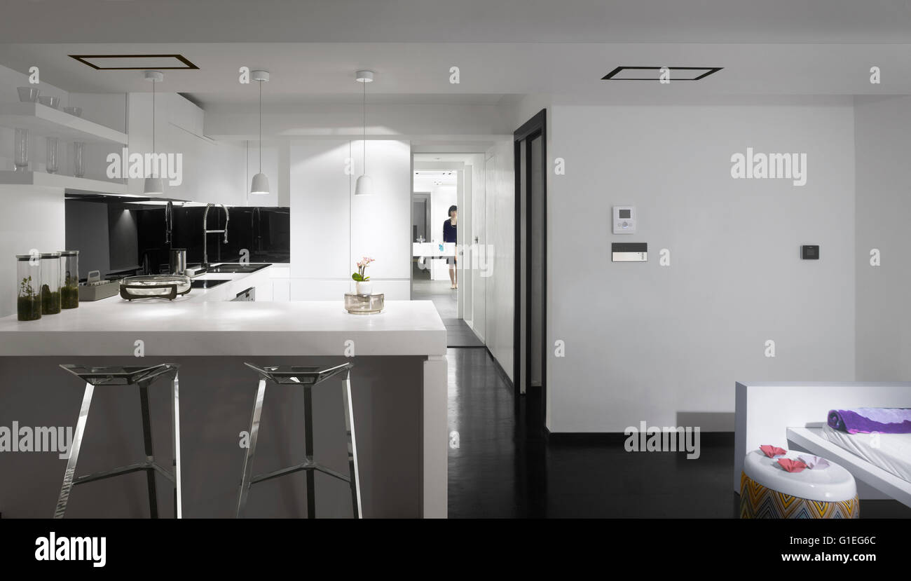 Kitchen in basement looking through to home spa. Kitchen with modern sleek features. Stock Photo