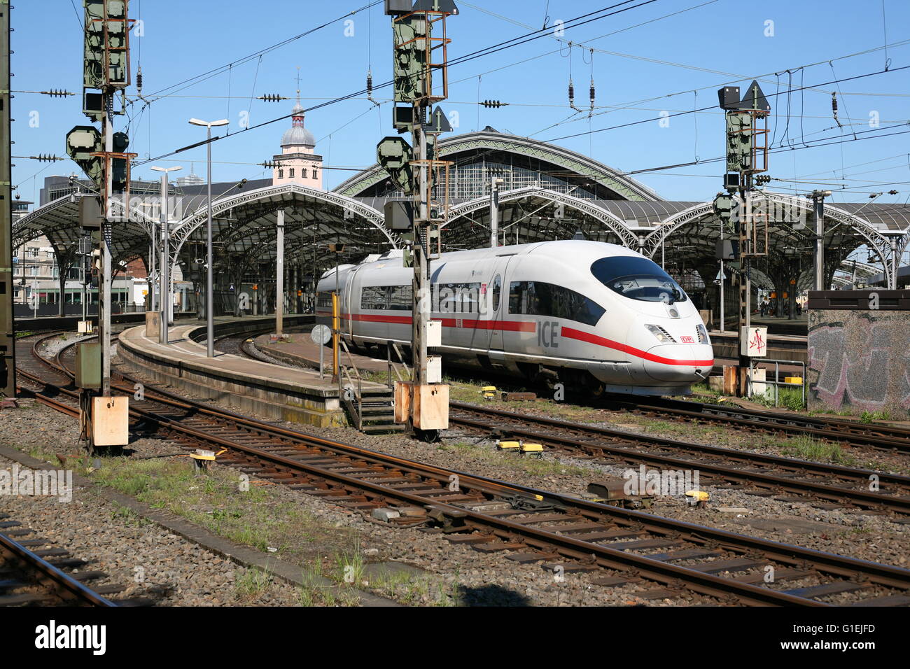 the central railway station in Cologne, Germany with a ICE train who is leaving the station Stock Photo