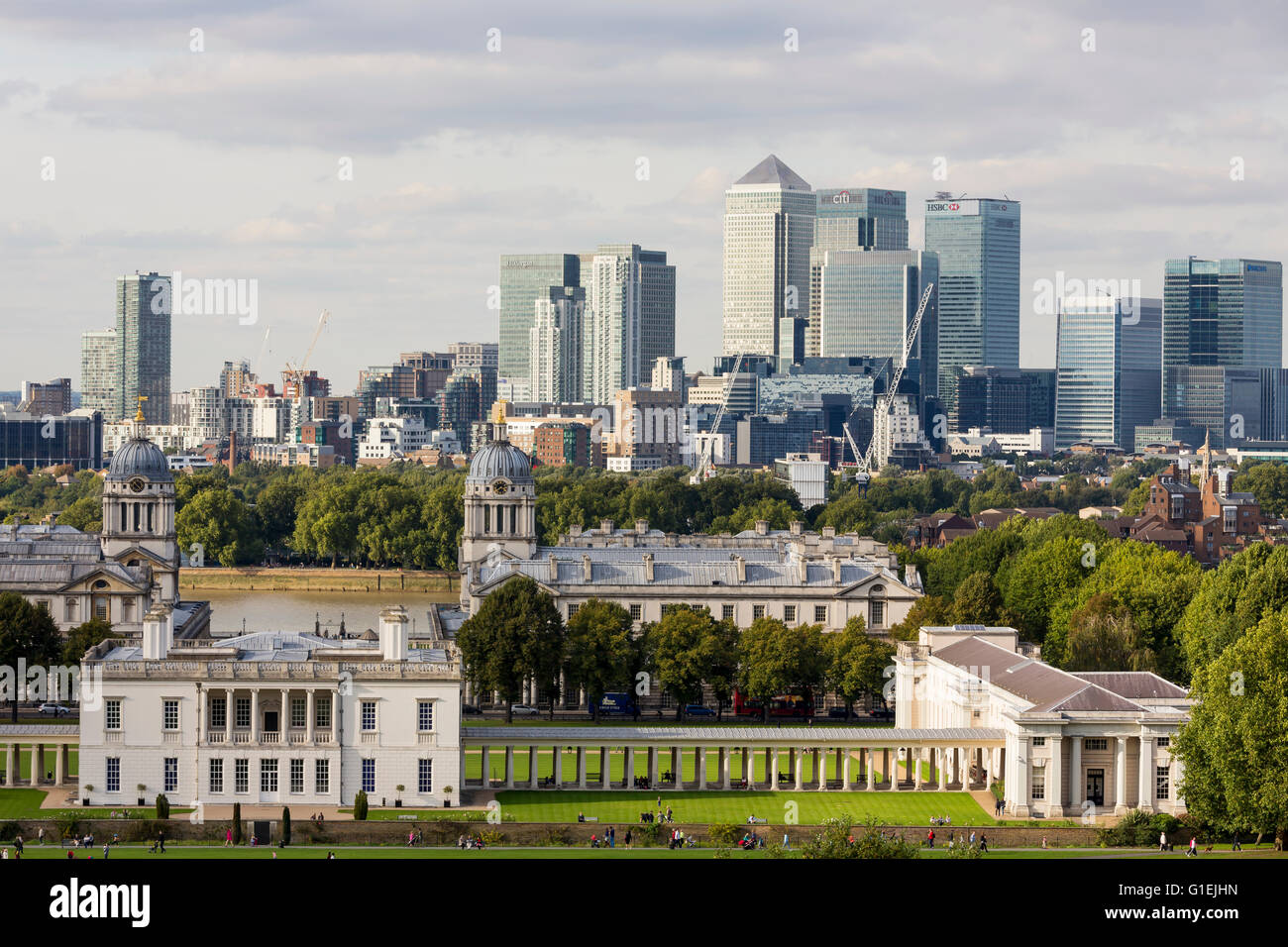 The Queen's House and the Royal Naval College with the skyline of Canary Wharf with the landmark corporate office buildings Stock Photo