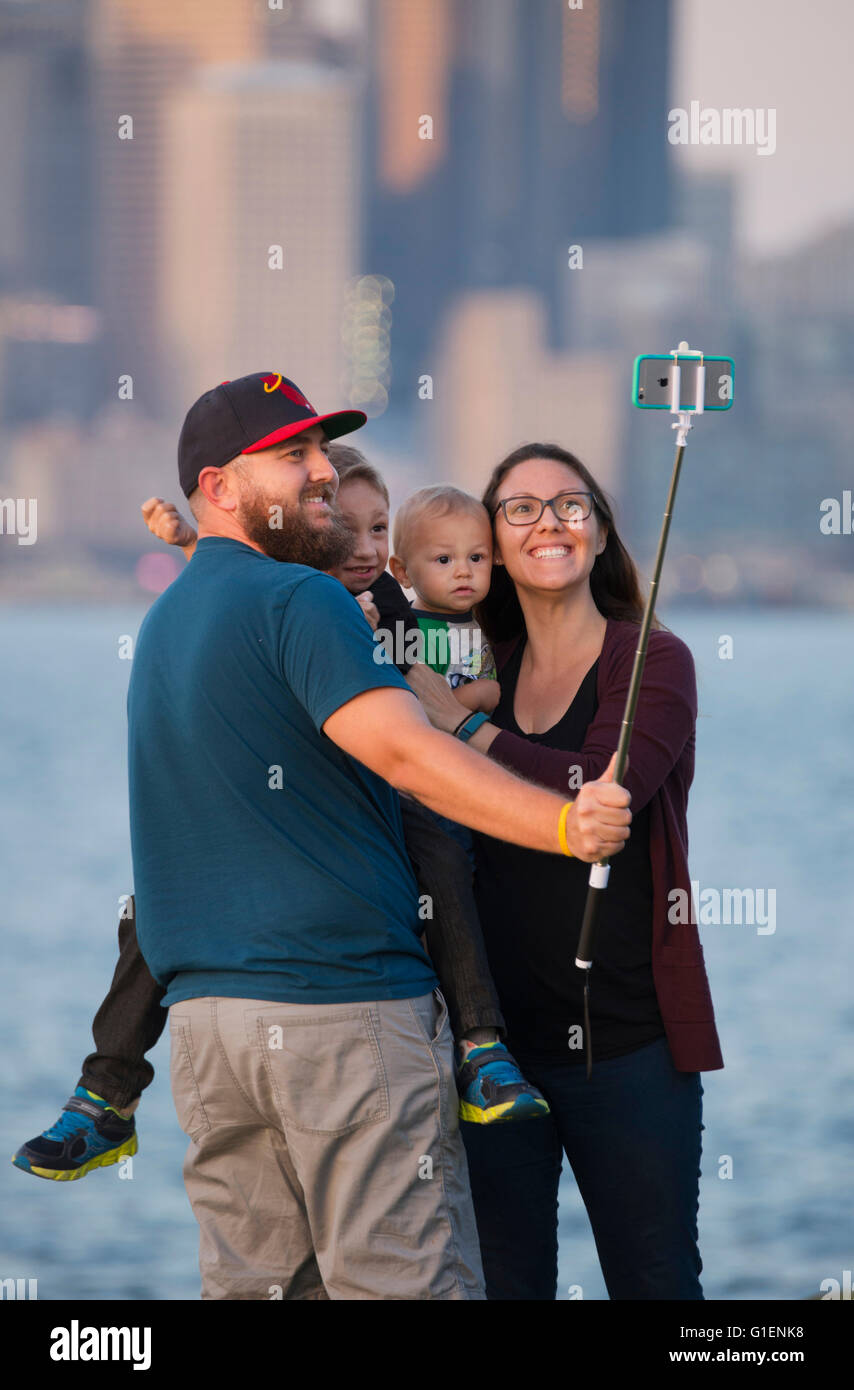 Family shoots sunset selfie with downtown Seattle in background Stock Photo