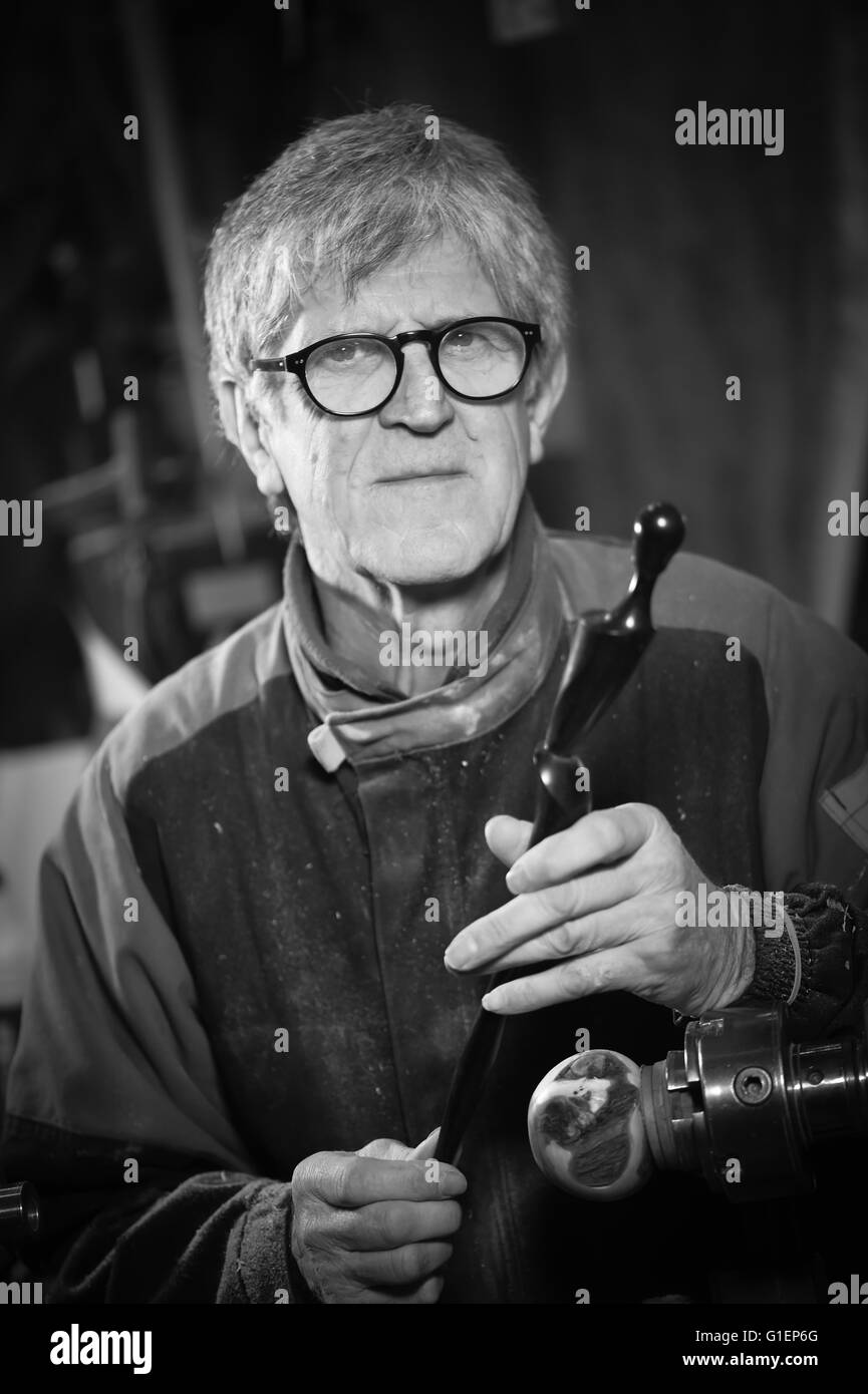Wood turners using a rotating clamp to turn the wood, France Stock