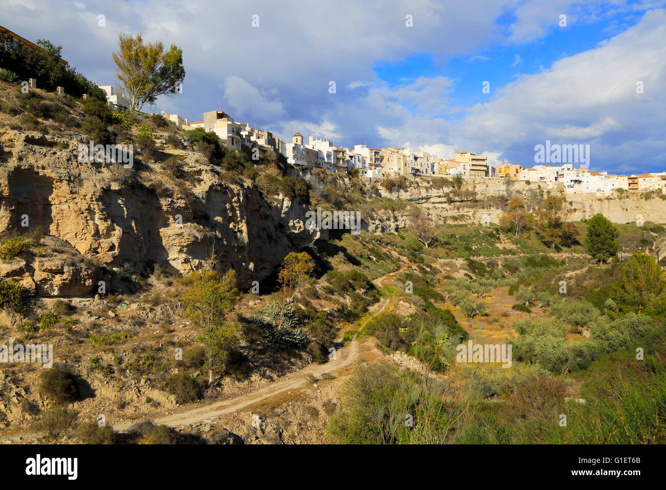 Buildings perched on edge of cliff top, Sorbas, Almeria, Spain Stock Photo