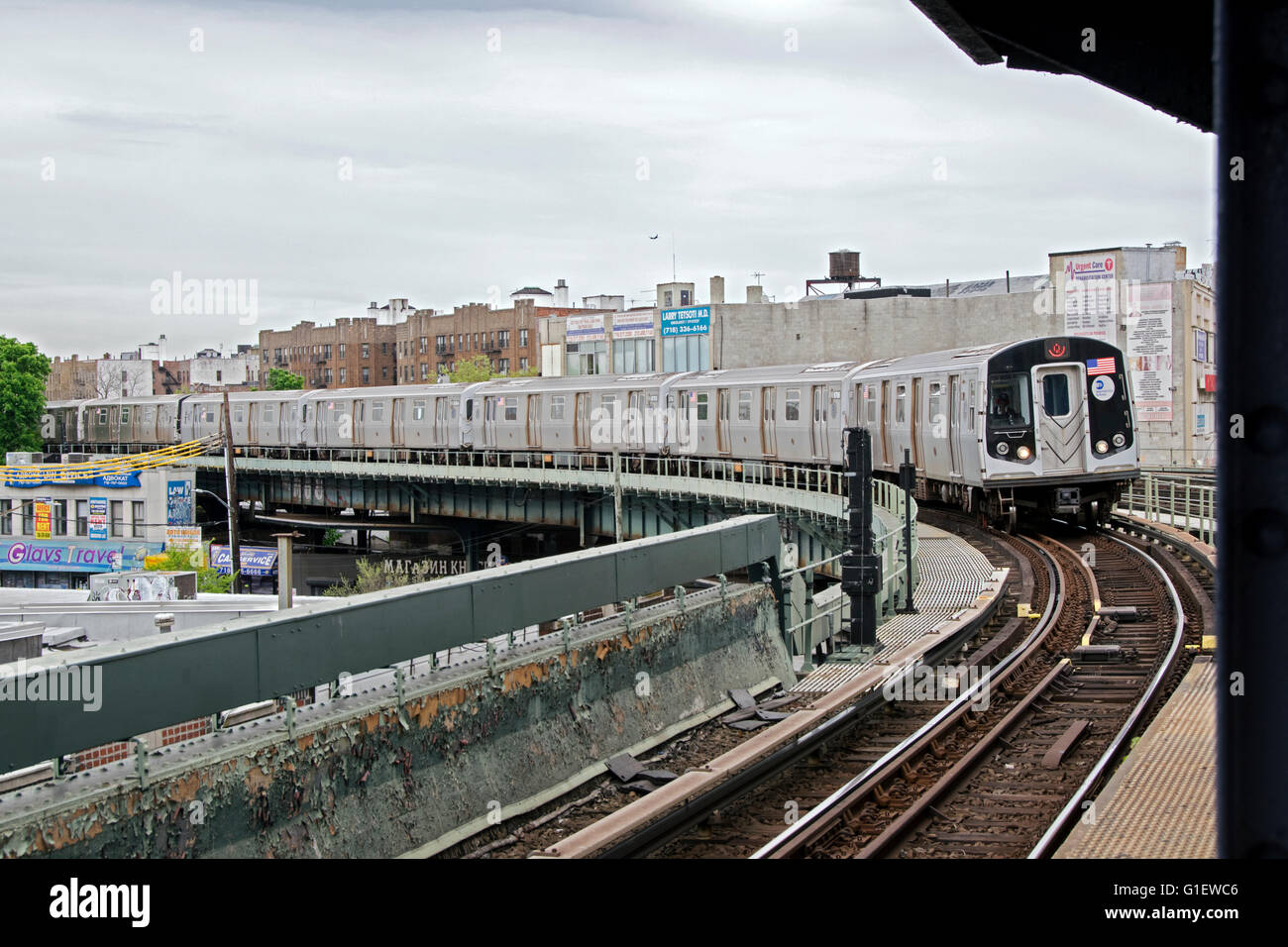 The Q subway pulling into the Brighton Beach elevated subway station in Brooklyn, New York. Stock Photo