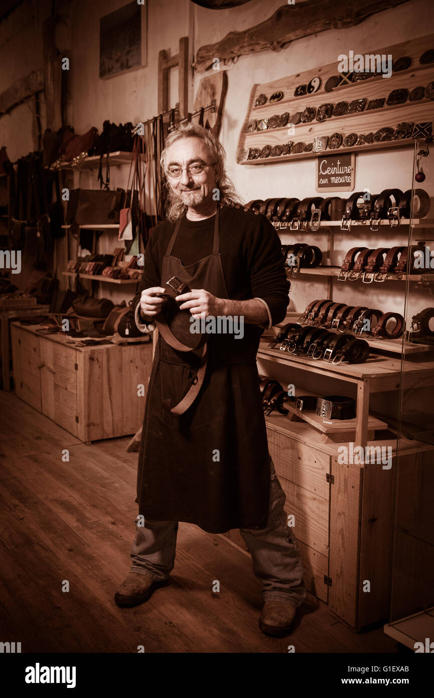 Leather goods craftsman at work in his hires stock