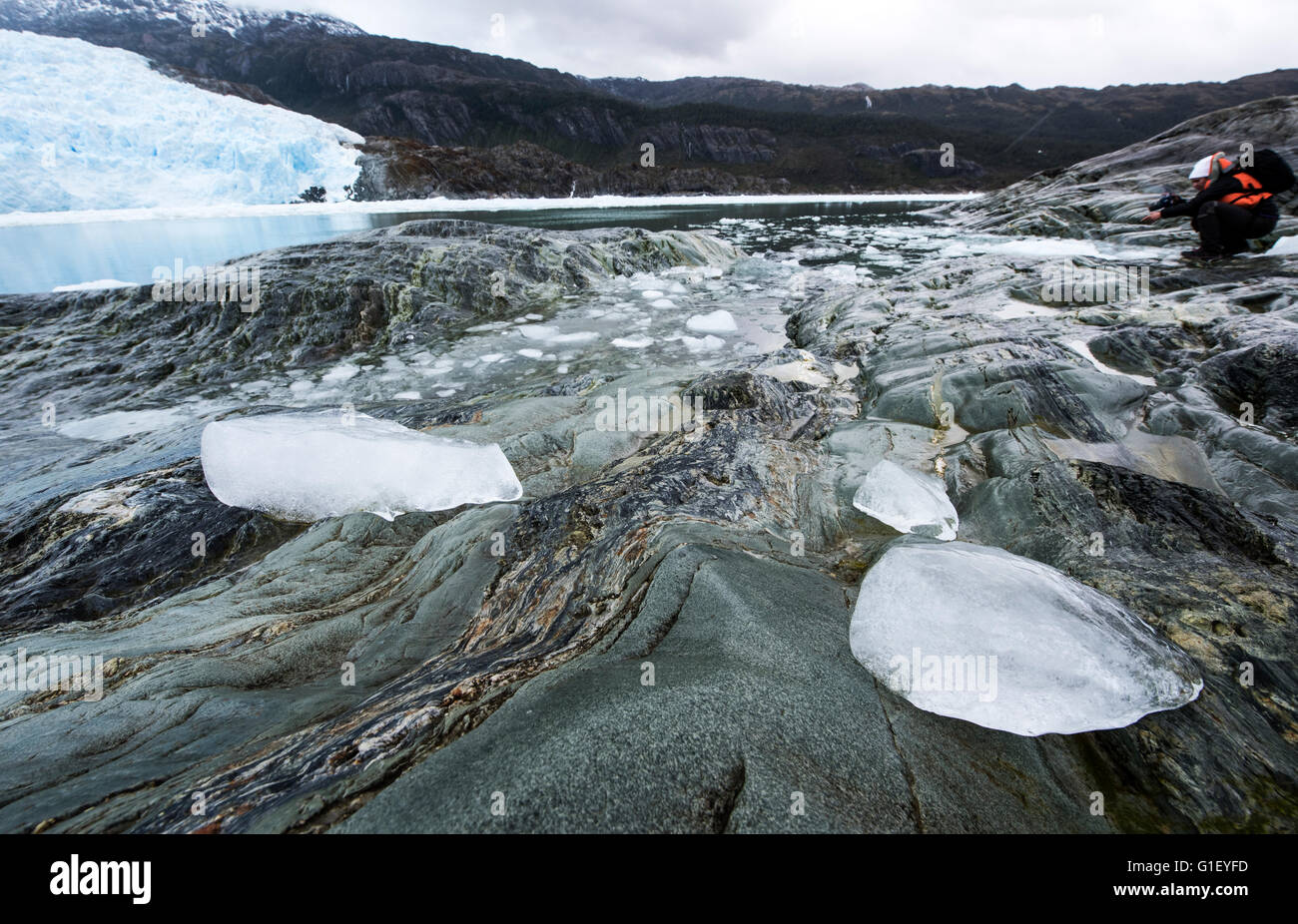 Tourist photographing Brujo Glacier Asia Fjord Patagonia Chile Stock Photo