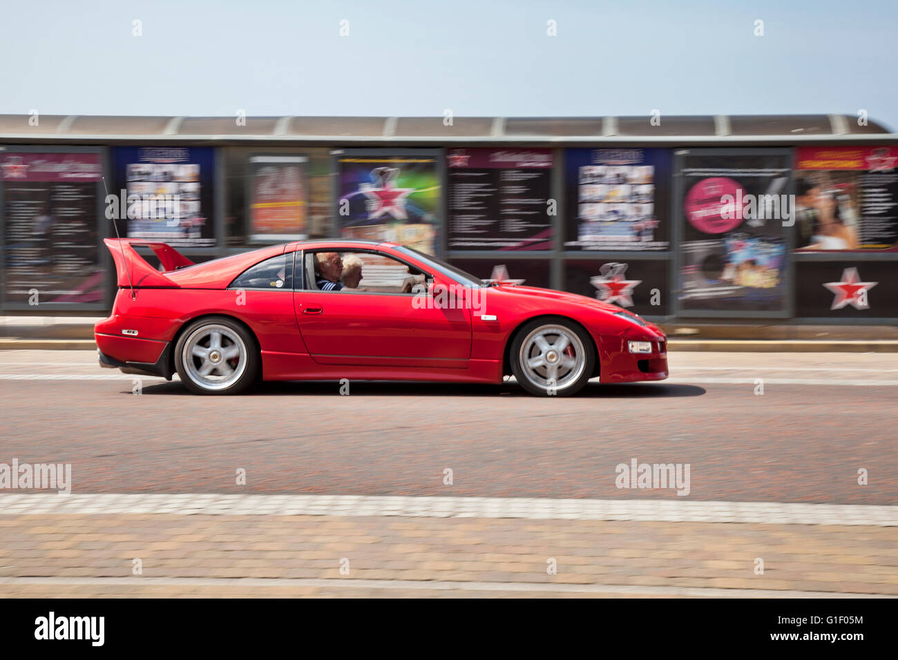 Nissan 300ZX sports car  in motion being driven along the seafront at Blackpool, Lancashire, UK. Stock Photo