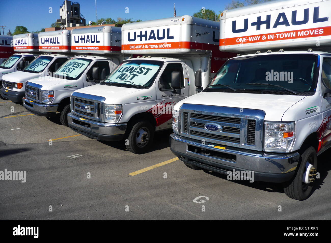 U-Haul self-transportation and storage trucks on a rental lot in suburban Utah. Stock Photo
