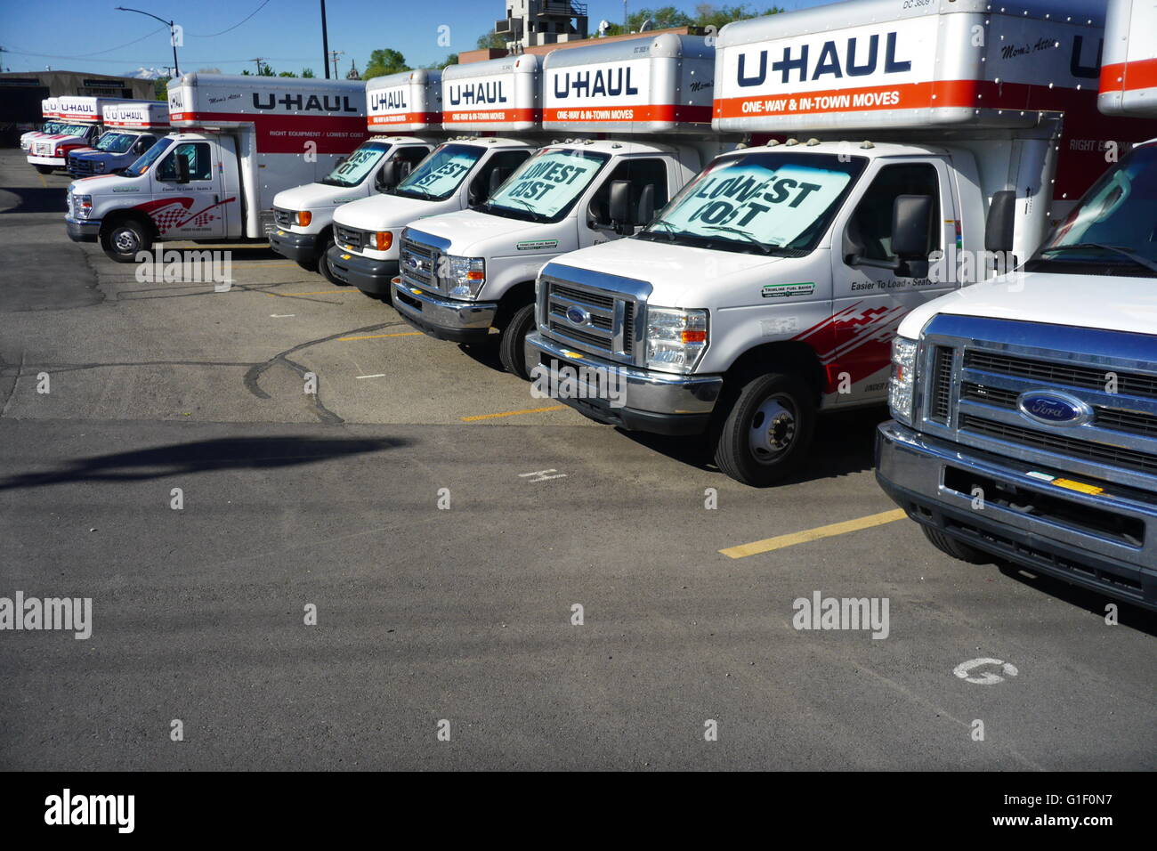 U-Haul self-transportation and storage trucks on a rental lot in suburban Utah. Stock Photo