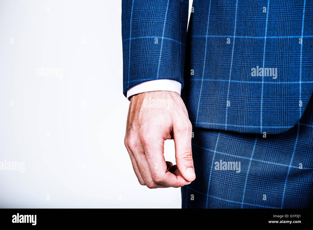 Detail of a businessman's hand with blue suit jacket Stock Photo Alamy