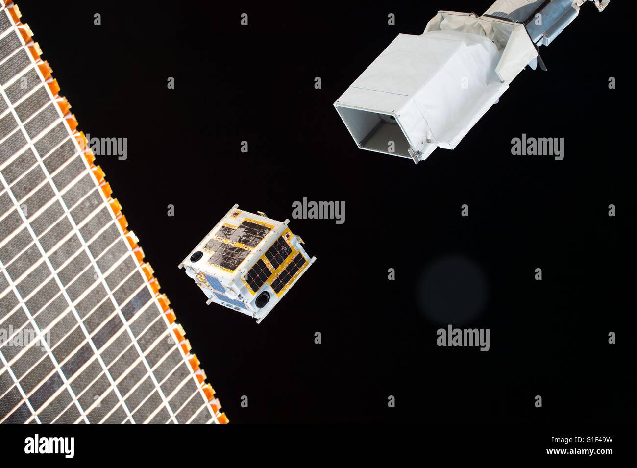The Japanese Philippine DIWATA-1 satellite is deployed from outside of Kibo module from the International Space Station April 27, 2016 in Earth Orbit. The micro satellite will observe earth and monitor climate changes and is owned by the Philippine government. Stock Photo