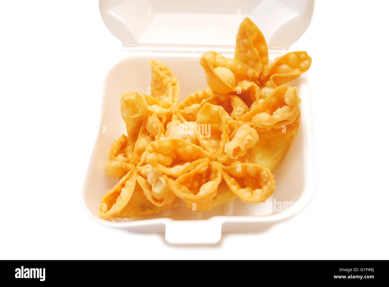Deep Fried Crab Rangoon Appetizers Served in a Takeout Container Stock Photo