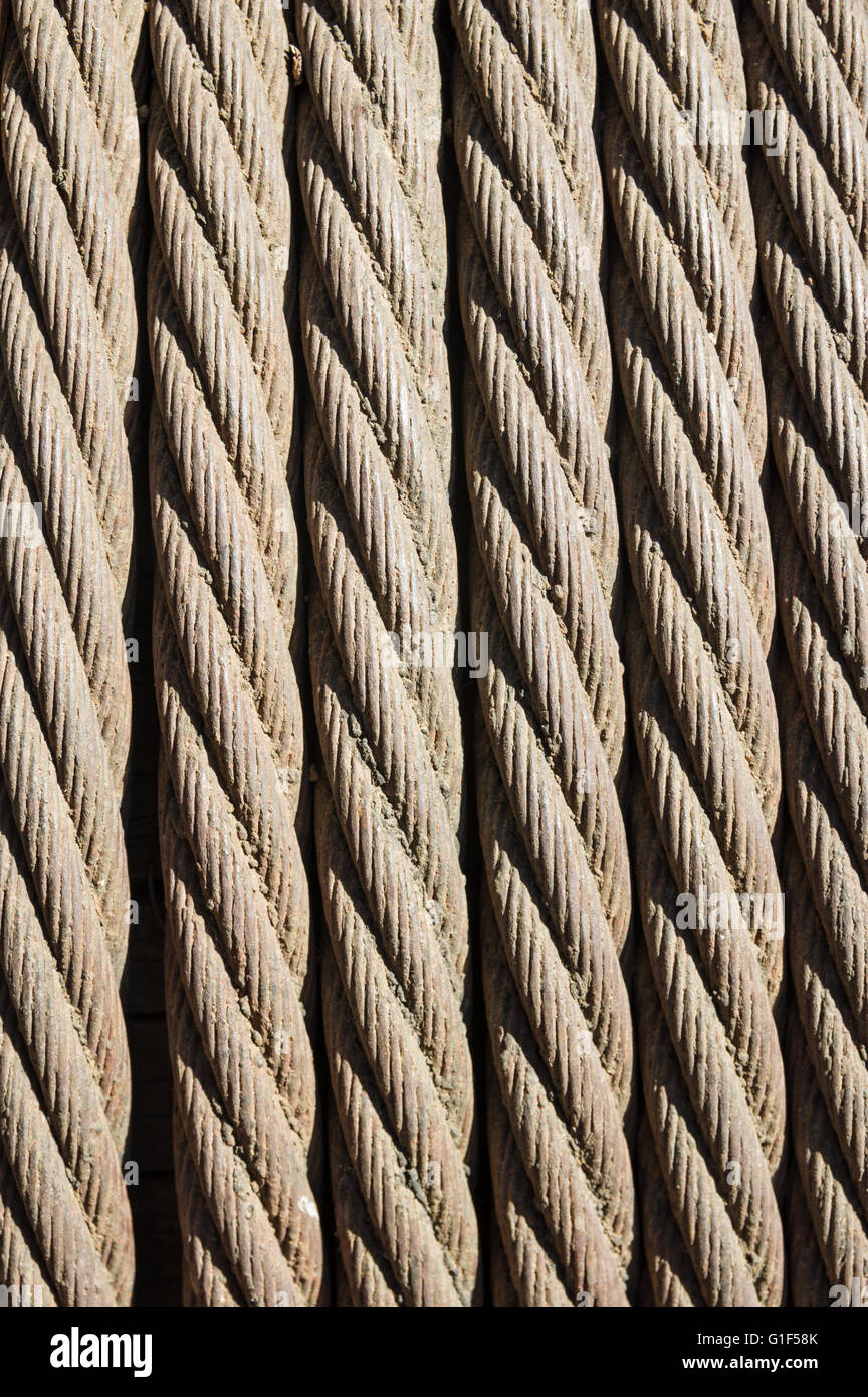 old twisted metal cable rope in a coil Stock Photo - Alamy
