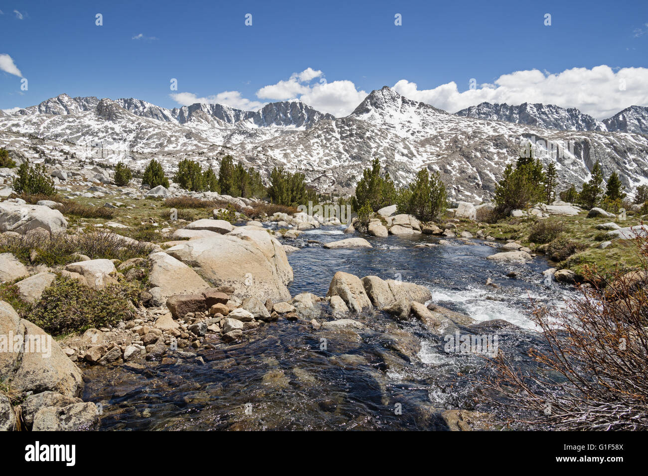 Sierra Nevada Landscape with Glacier Divide viewed from Humphreys Basin with stream in foreground Stock Photo