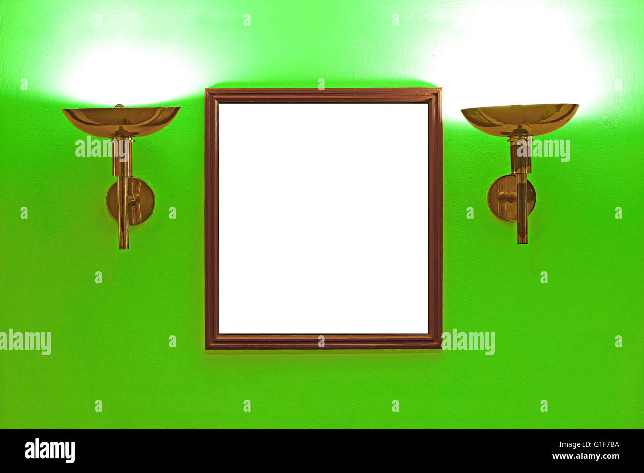 gallery interior, empty picture frames on green wall with lighting Stock Photo