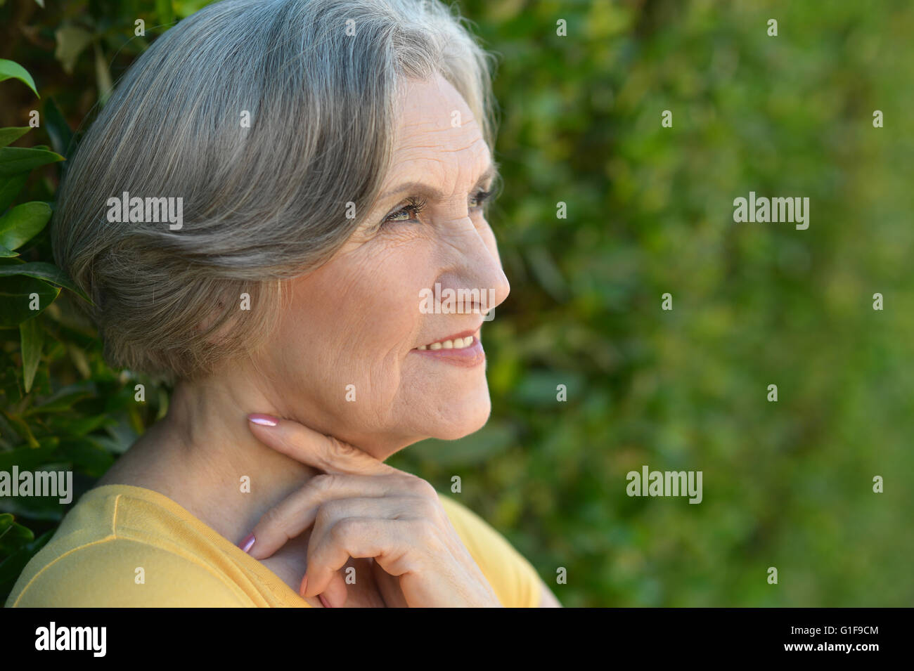 senior woman in summer park Stock Photo