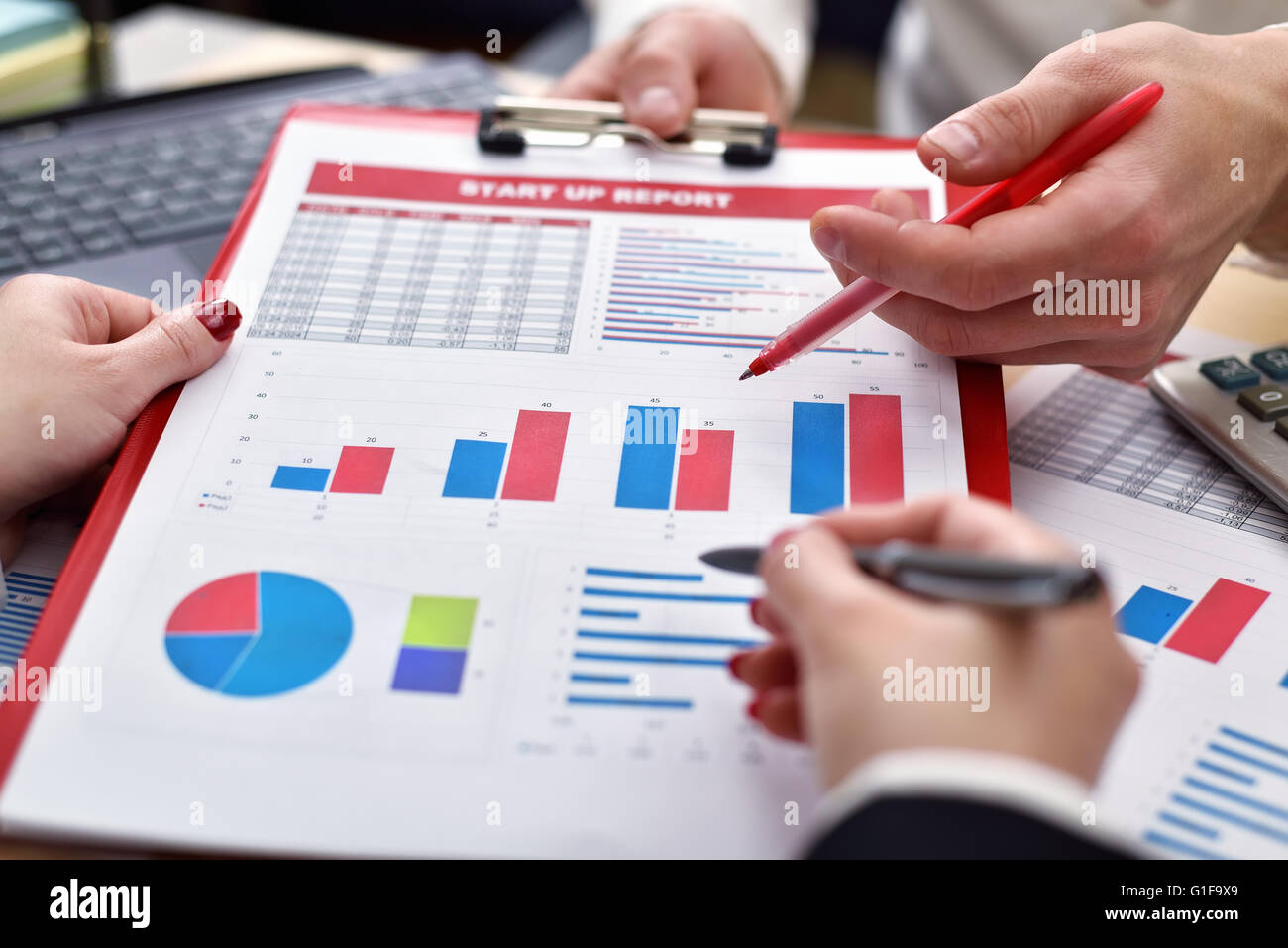 co worker hands during paperwork at meeting Stock Photo