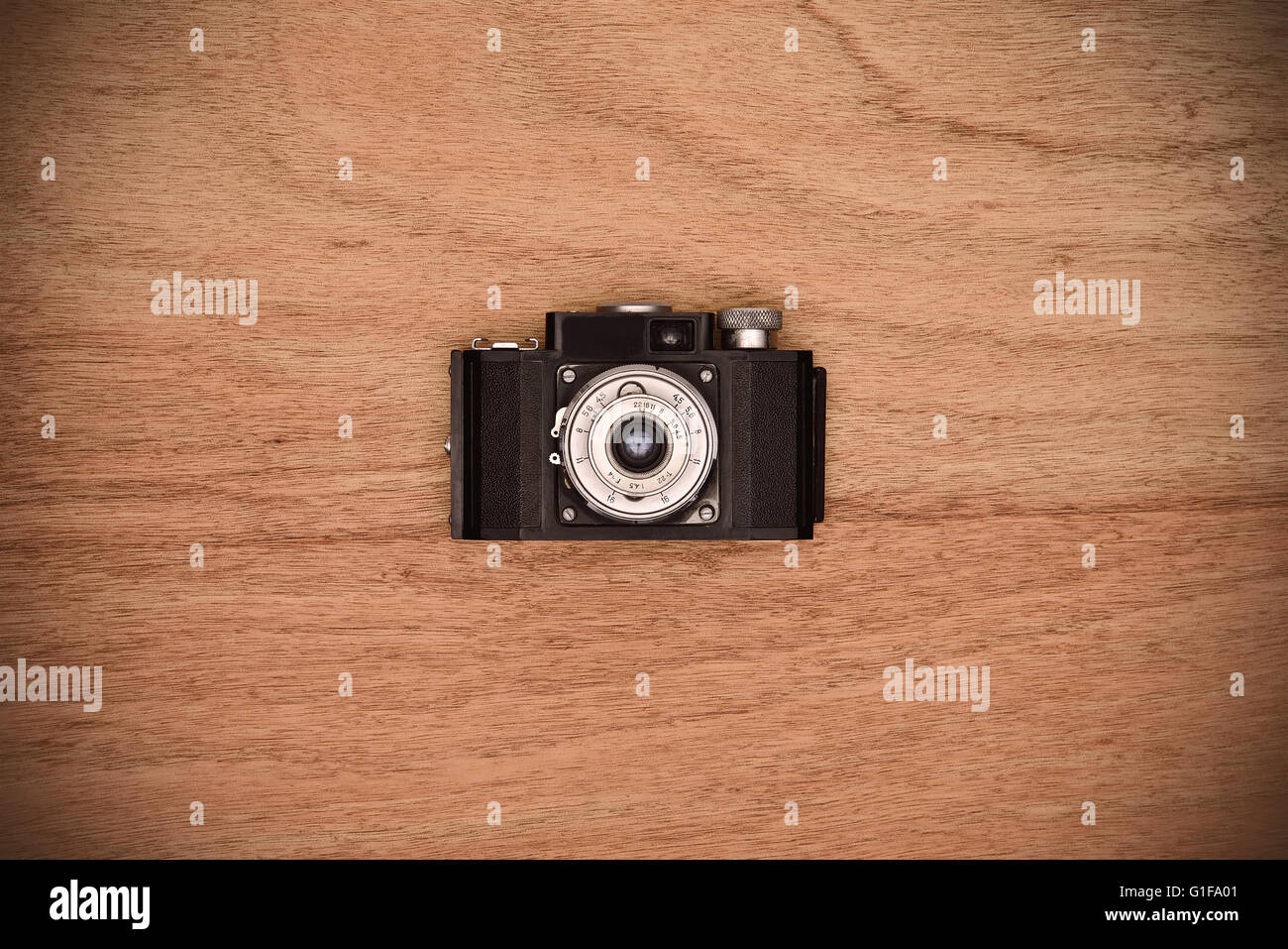 retro vintage camera on a wooden table Stock Photo