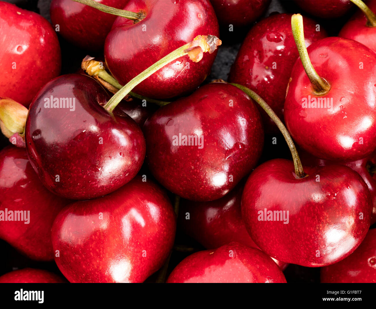 fresh cherries on a black stone, big size photo, high resolution Stock Photo