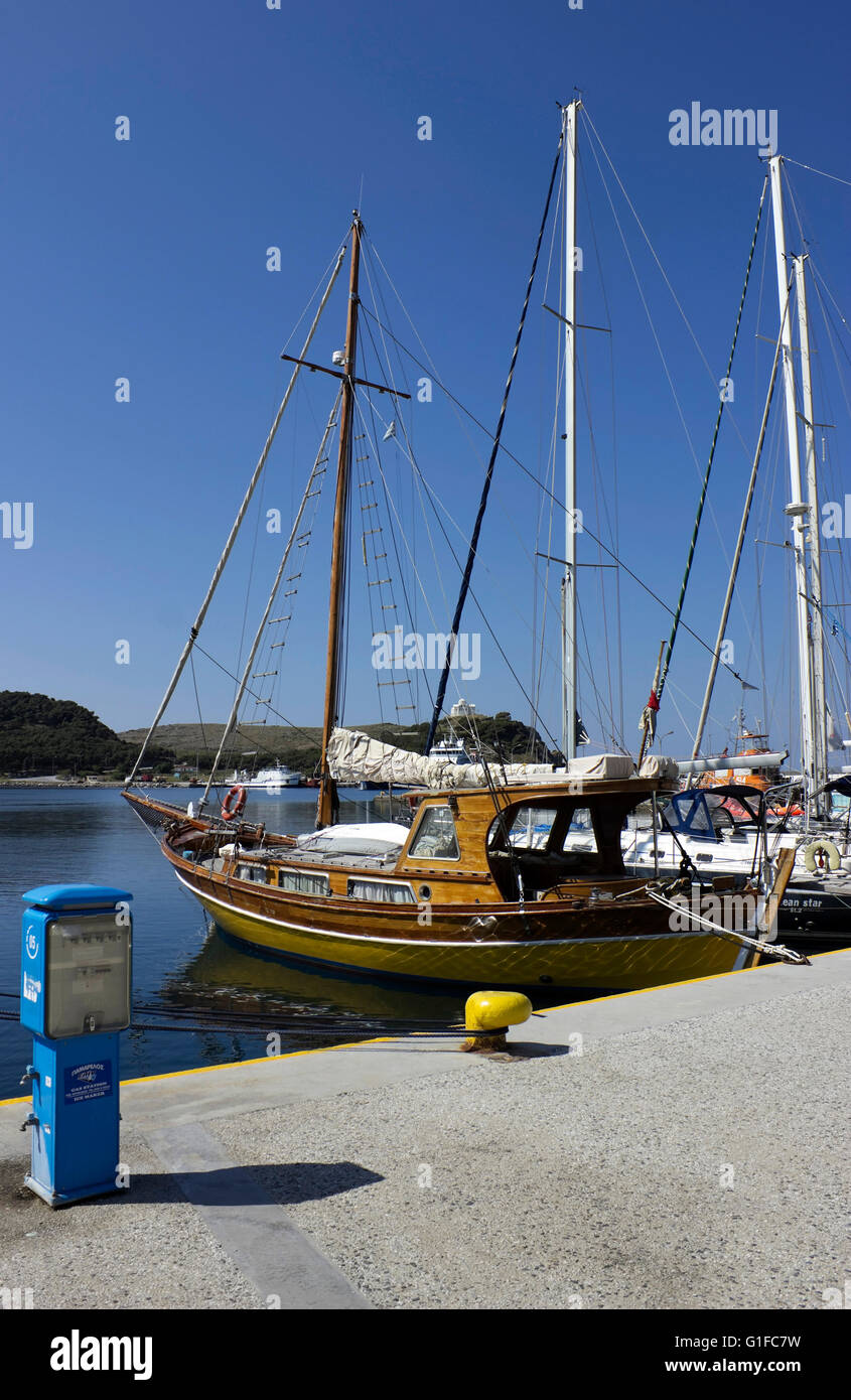 A luxurious wooden private sailing clipper anchored in Myrina's harbour