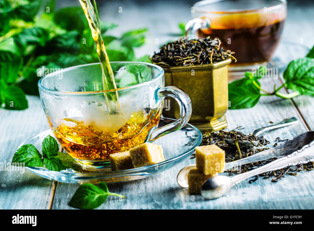 Tea. Mint Tea. Herbal tea. Mint leaf. Mint leaves. Tea in a glass cup, mint leaves, dried tea, sliced lime. herbs tea and mint l Stock Photo