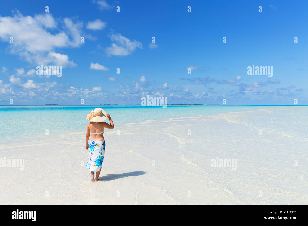 Woman on tropical island, South Male Atoll, Kaafu Atoll, Maldives Stock Photo