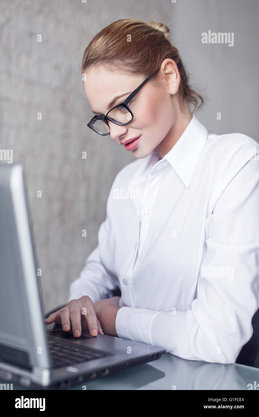 Happy white blonde woman typing hi-res stock photography and images - Alamy