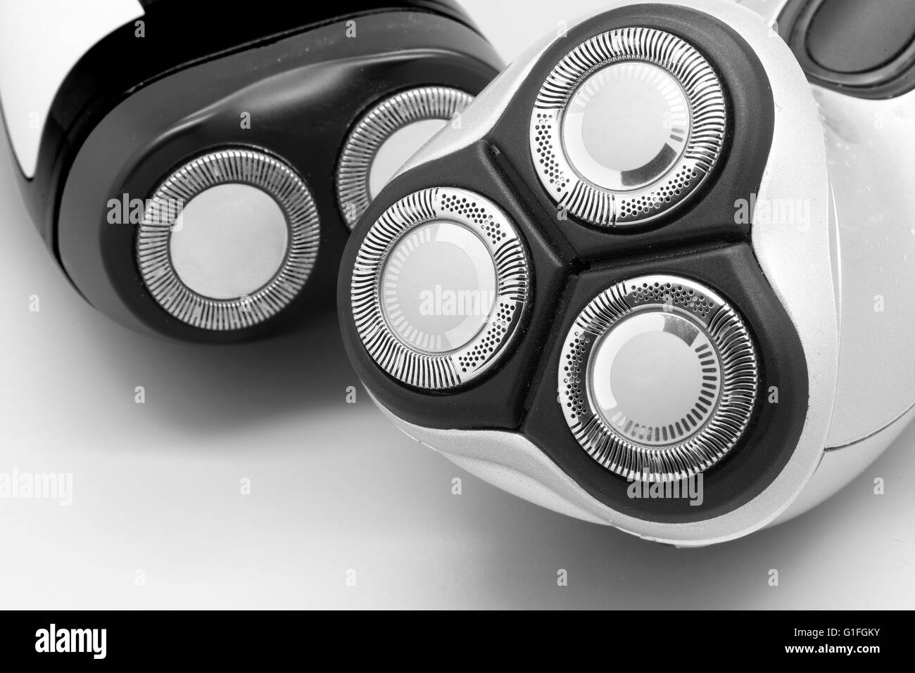 Two electric shaver with circular closecut blades Stock Photo Alamy