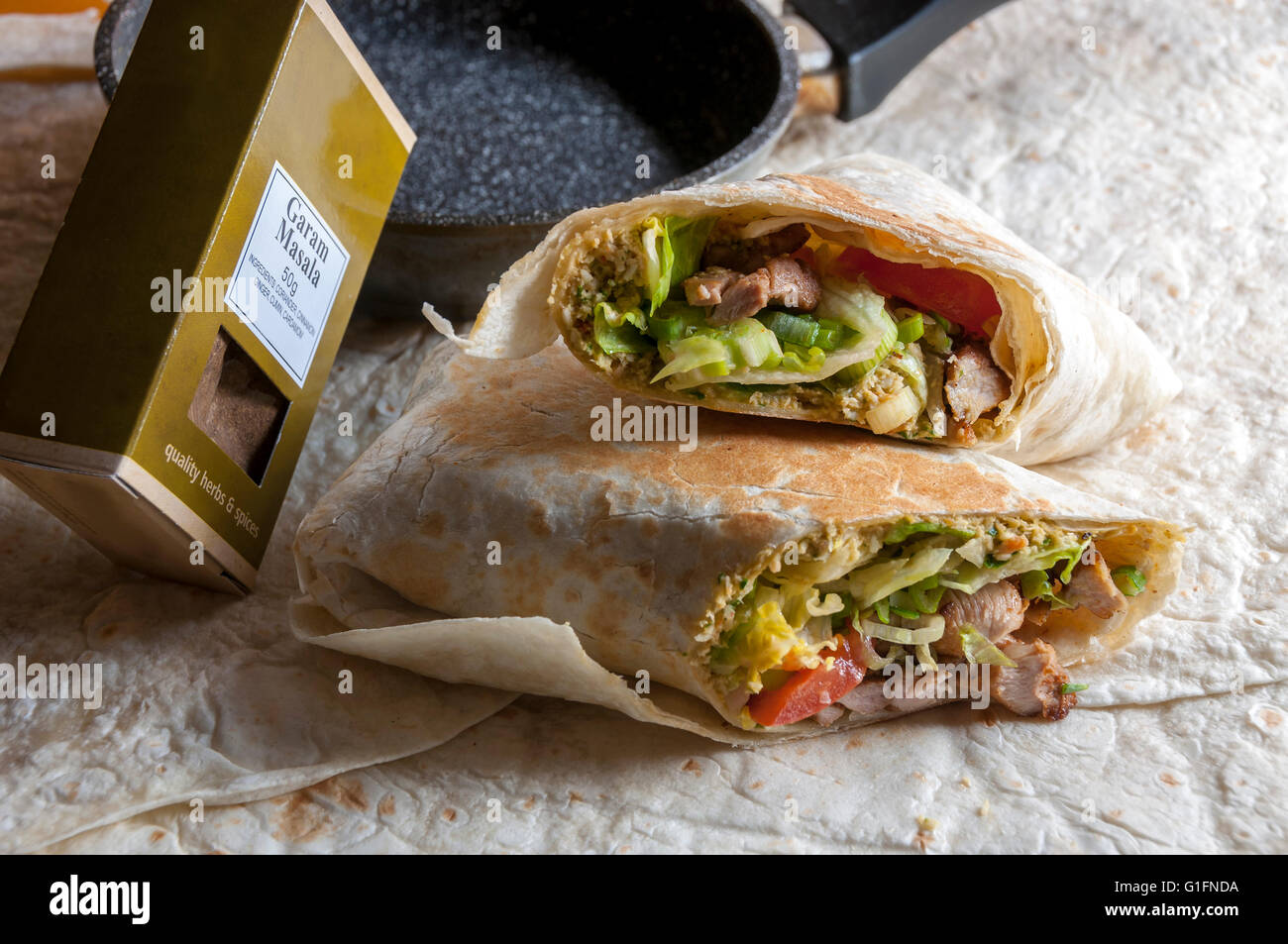 Tasty indian wrap with chicken meat and garam masala spices Stock Photo