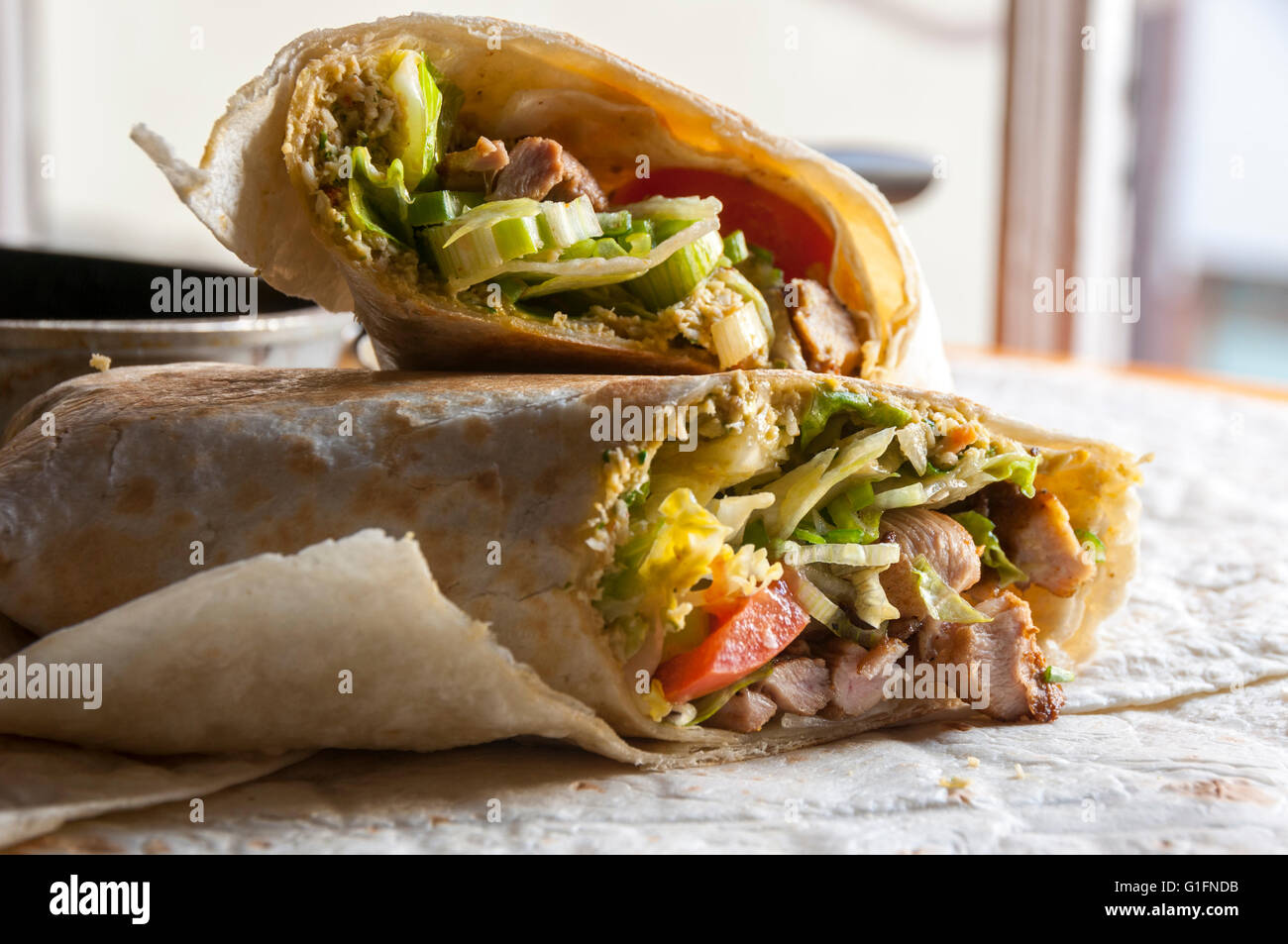 Tasty indian wrap with chicken meat and garam masala spices Stock Photo