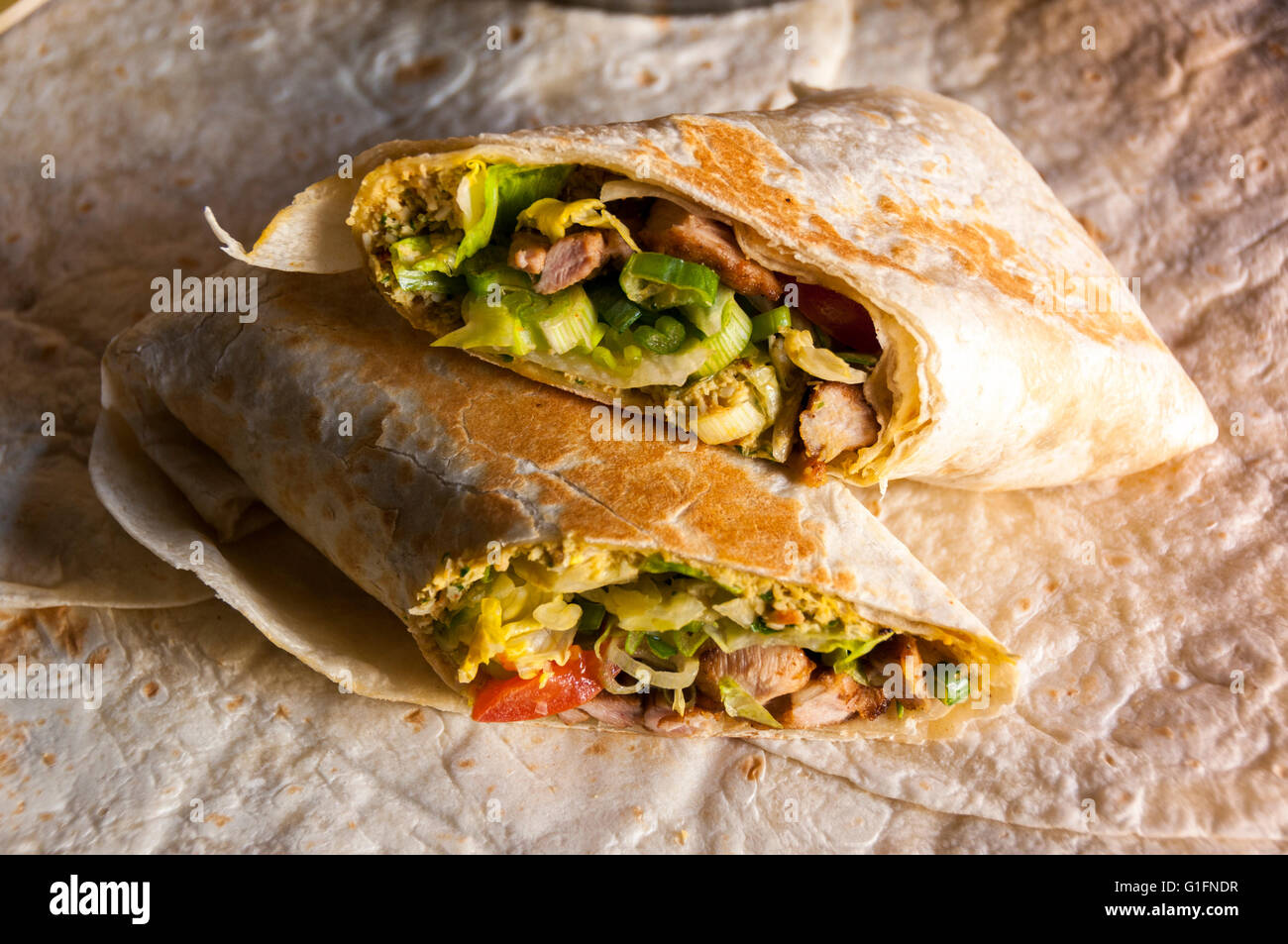 Tasty indian wrap with chicken meat and garam masala spices Stock Photo