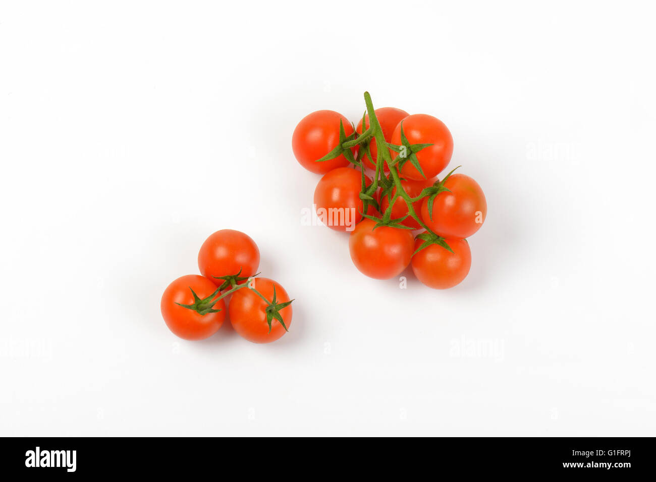 ripe cherry tomatoes on white background Stock Photo - Alamy