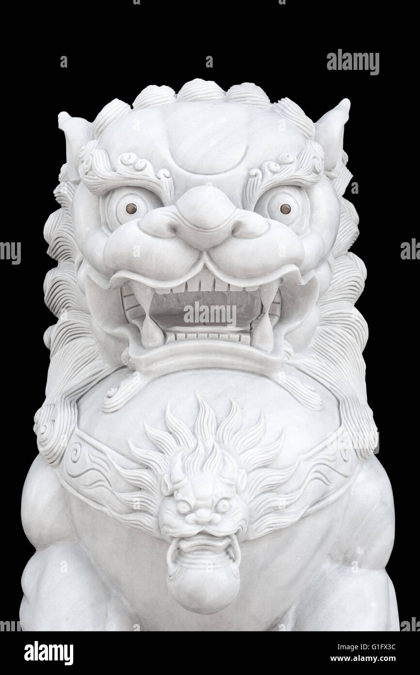 Chinese Imperial Lion statue isolated on black background. Stock Photo