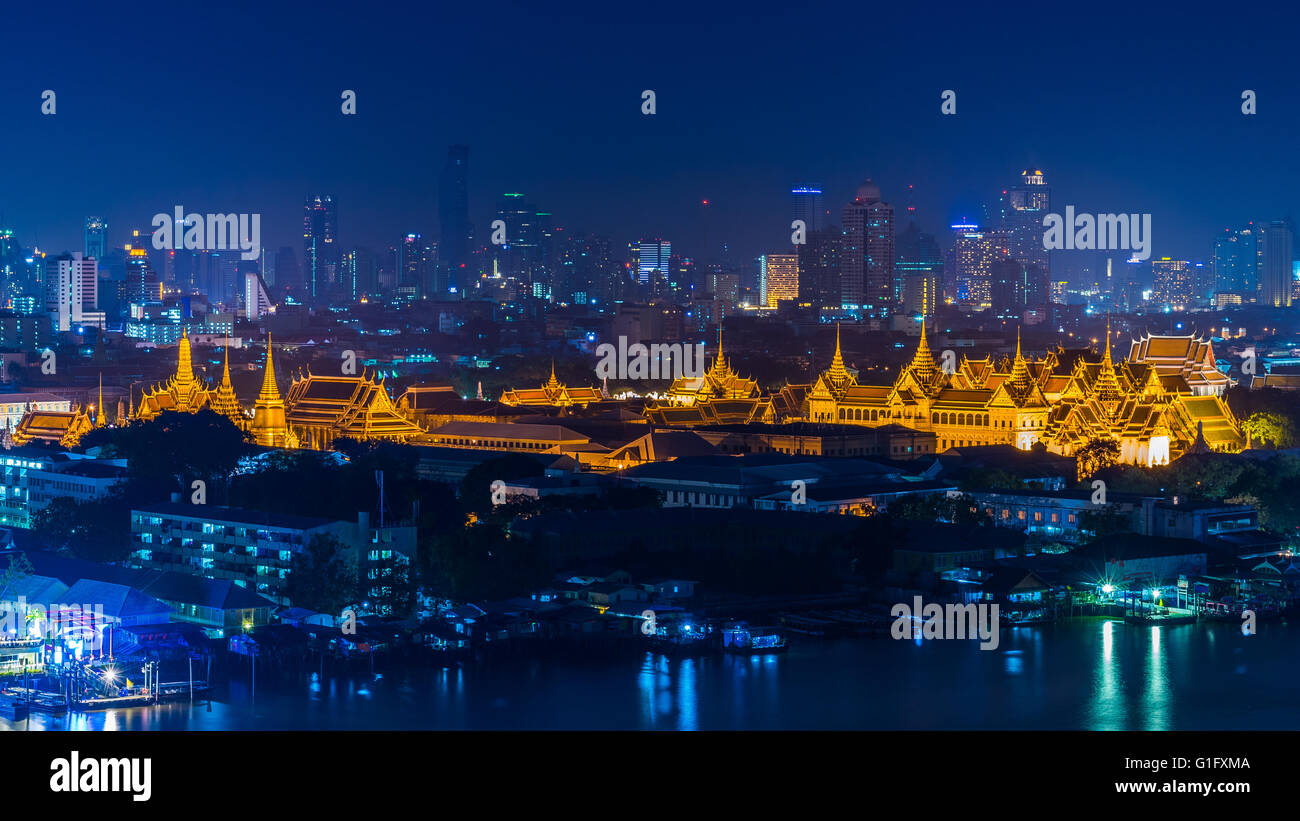 View of the golden Grand Palace and Chao Phraya river, a major landmark in Bangkok. Stock Photo