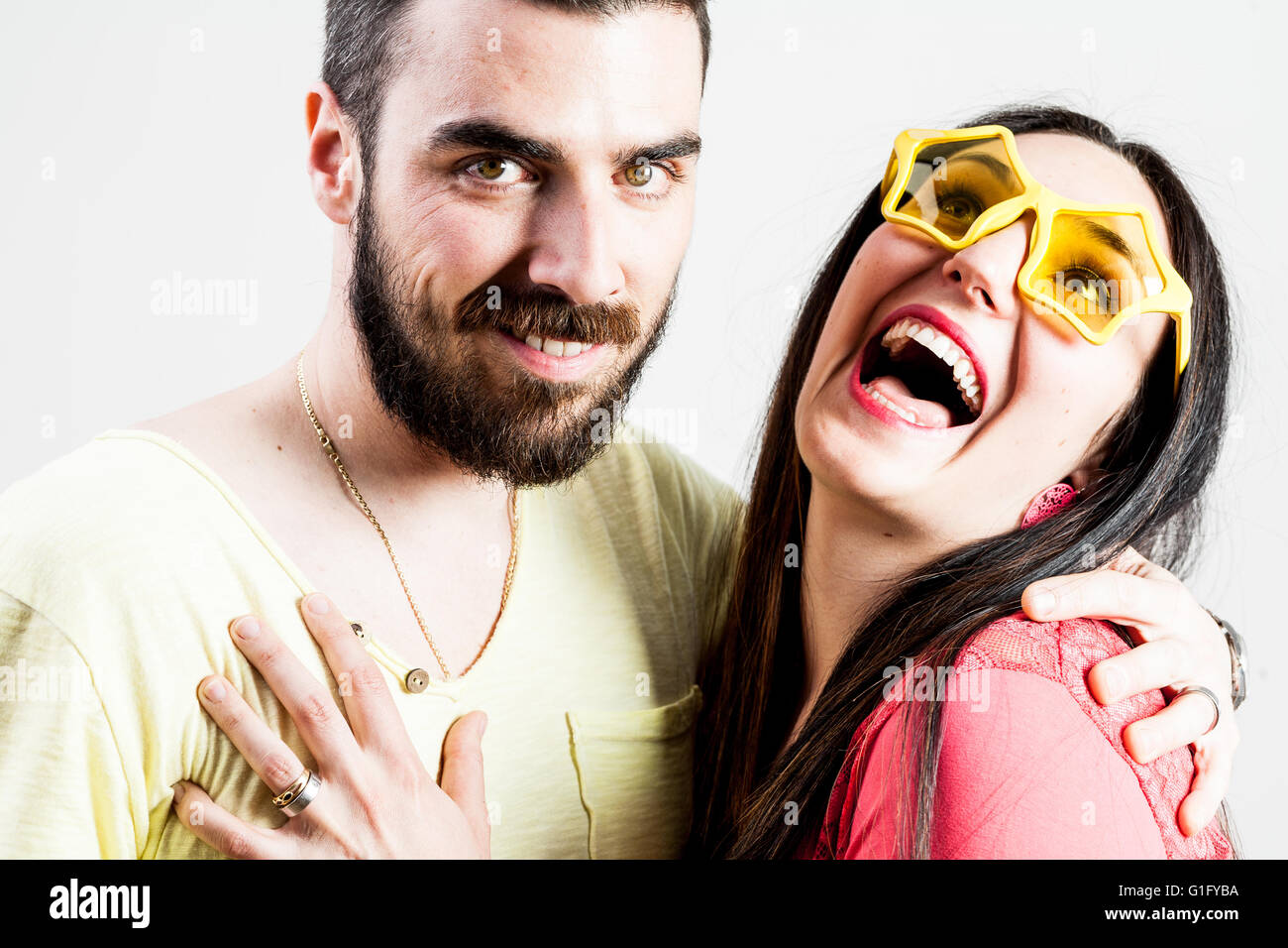 cool bearded man with a very excited woman with star shaped glasses ...
