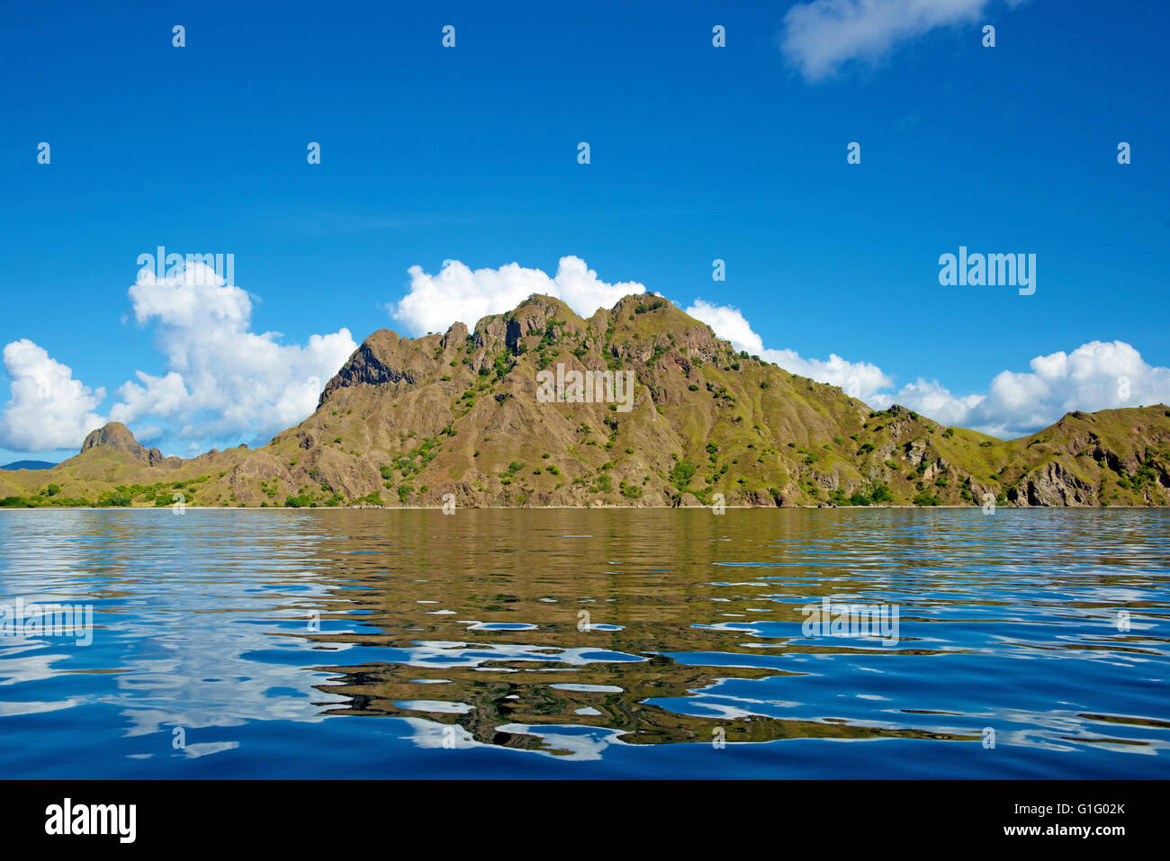 Reflections in calm sea Padar Island Komodo National Park Indonesia Stock Photo