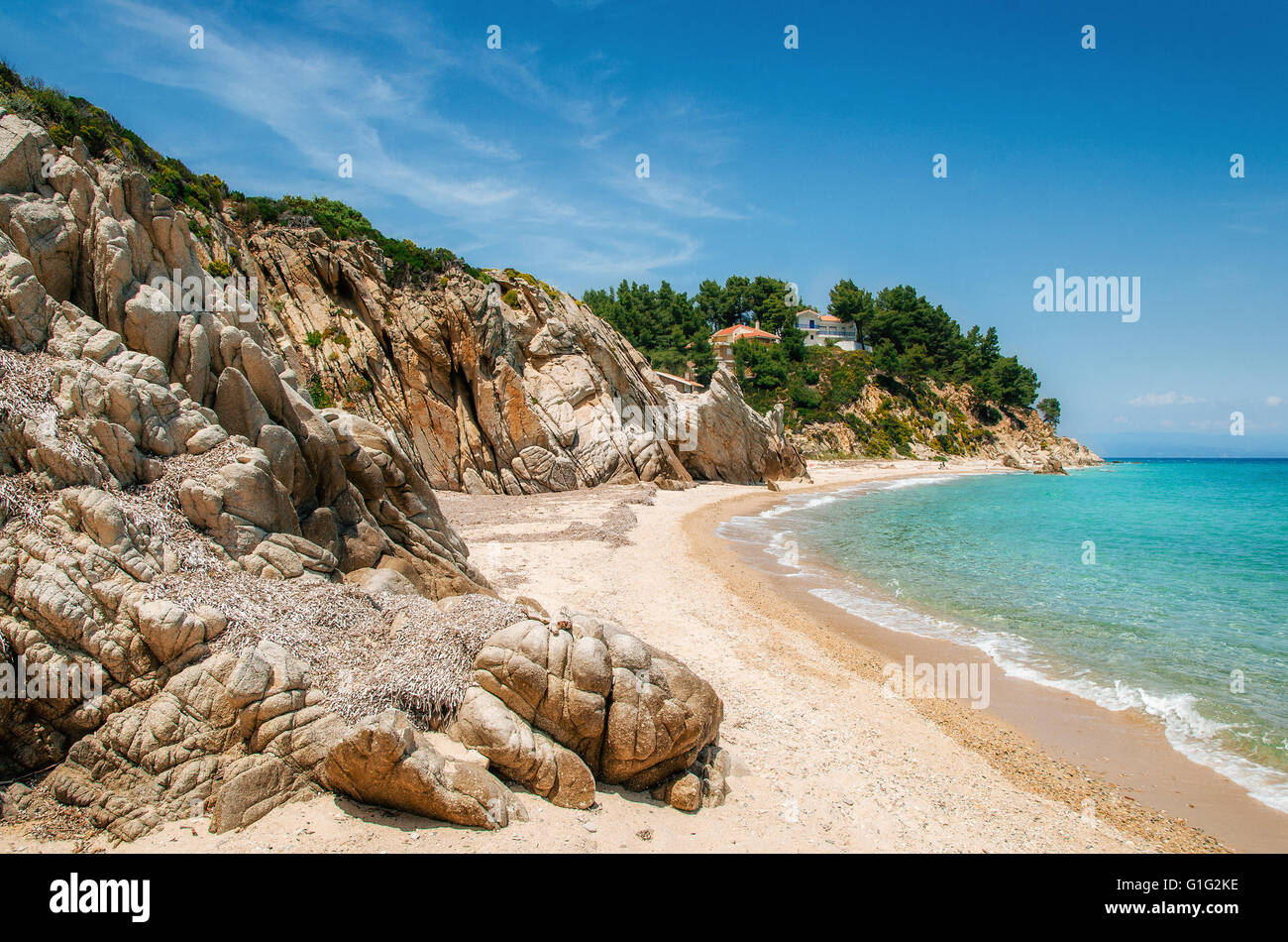 wild-beach-with-stones-and-sand-in-vourvourou-sithonia-greece-stock