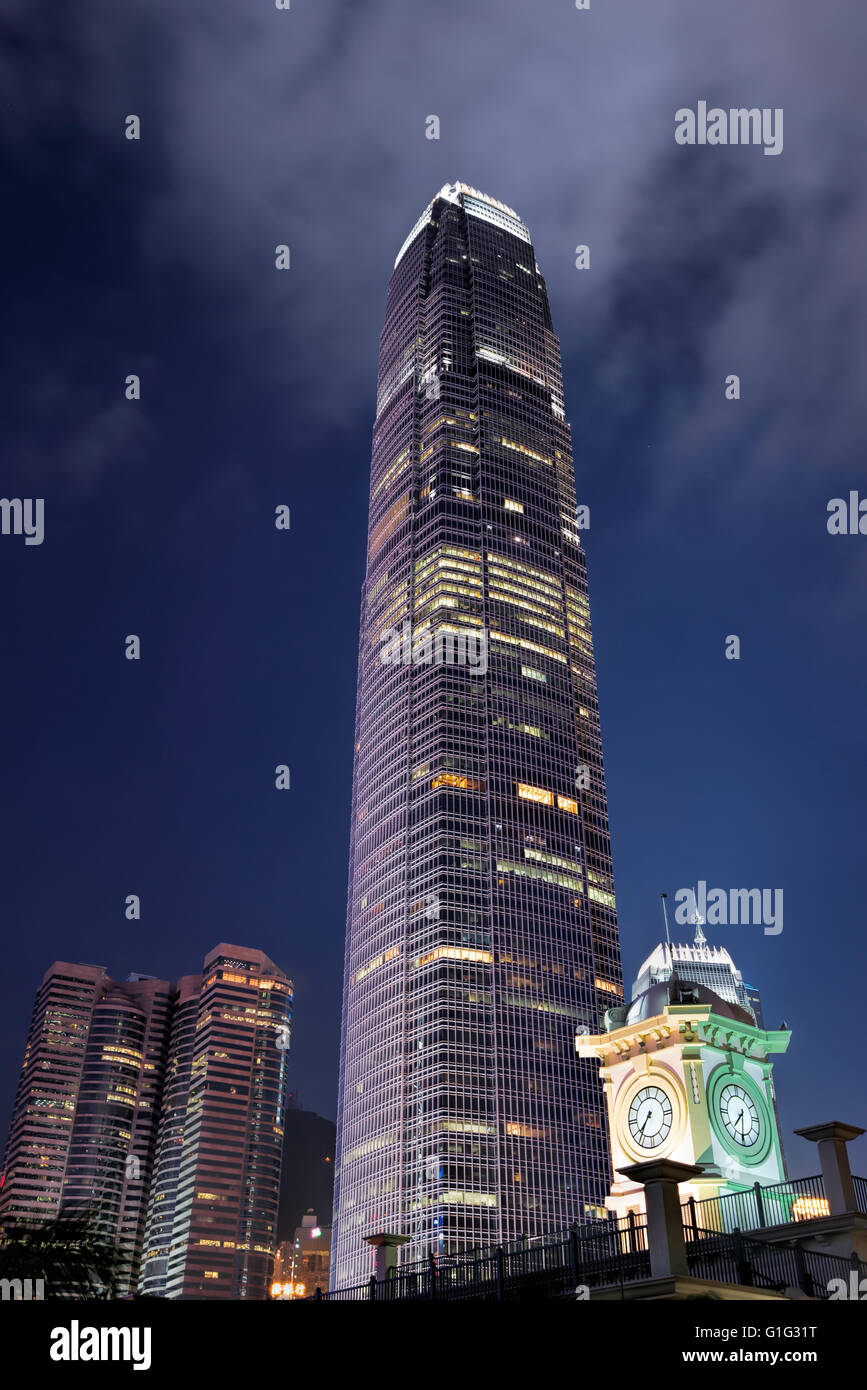 Two International Finance Center, IFC2, and the Star Ferry clock tower, Central financial district, Hong Kong, China. Stock Photo