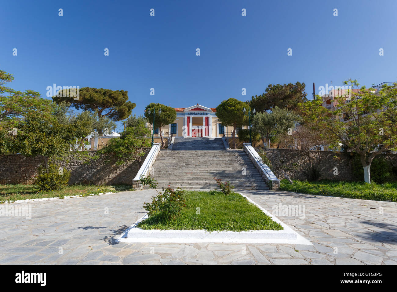 Karystos city hall in the morning against a blue sky in Greece Stock Photo