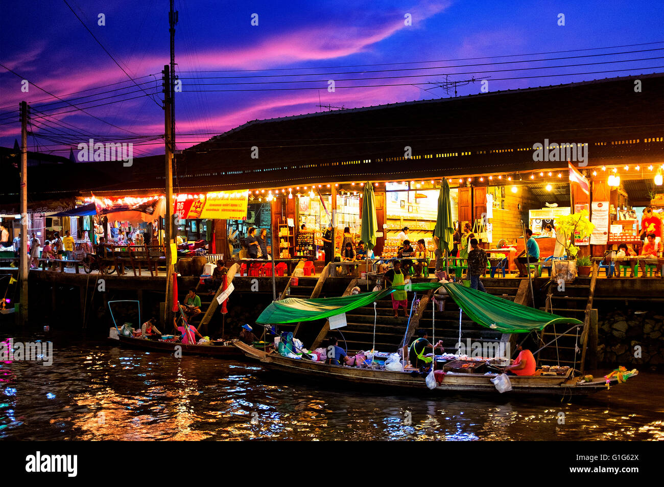 Amphawa floating market at sunset, Amphawa, Thailand Stock Photo