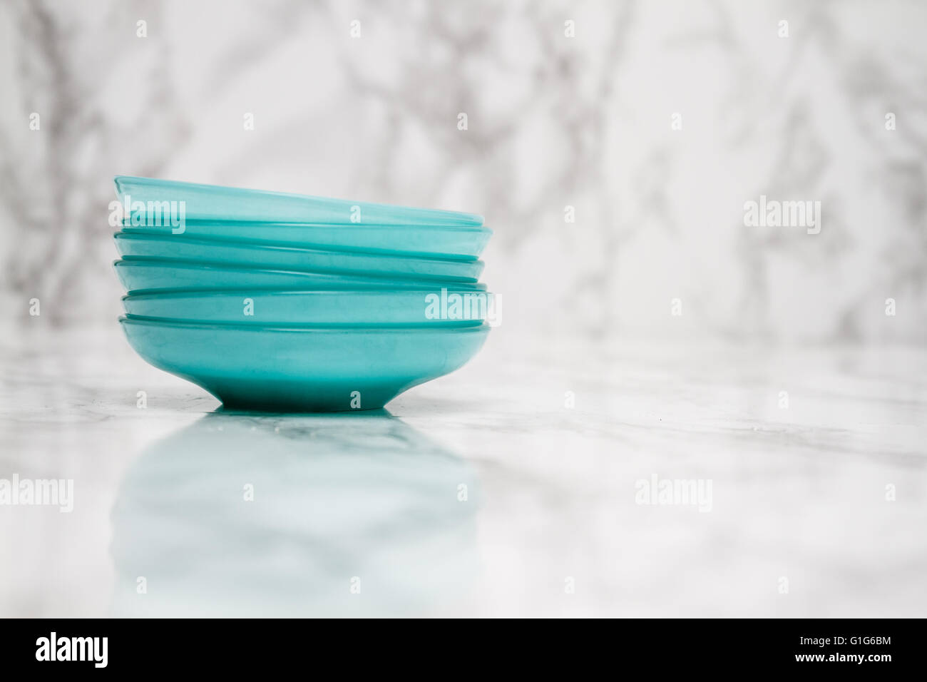 Traditional green Turkish tea plates on white marble background Stock