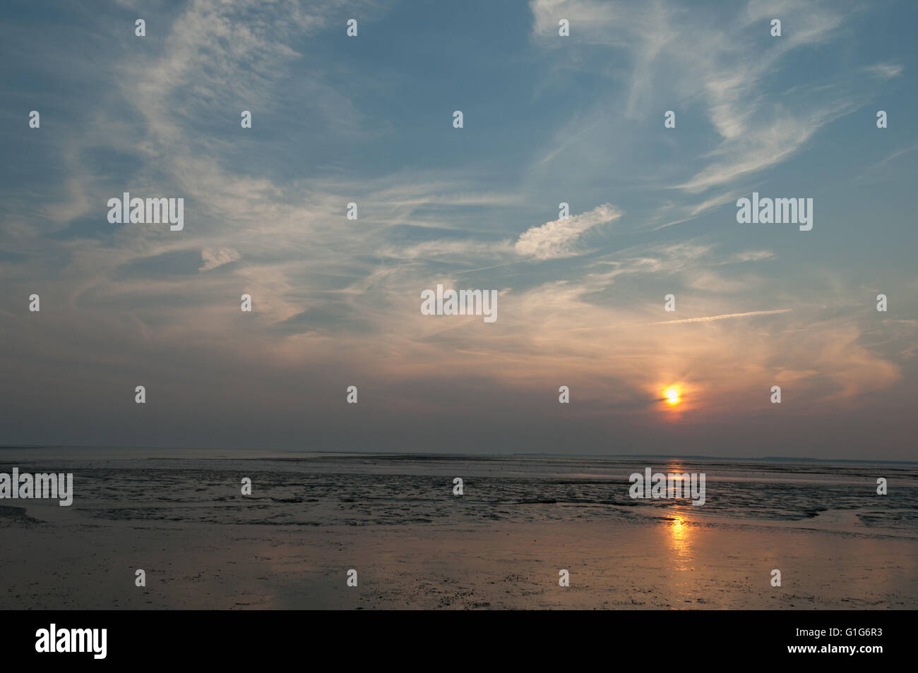 Waddensea tidal flats wetlands at sunset, Northern Germany Stock Photo