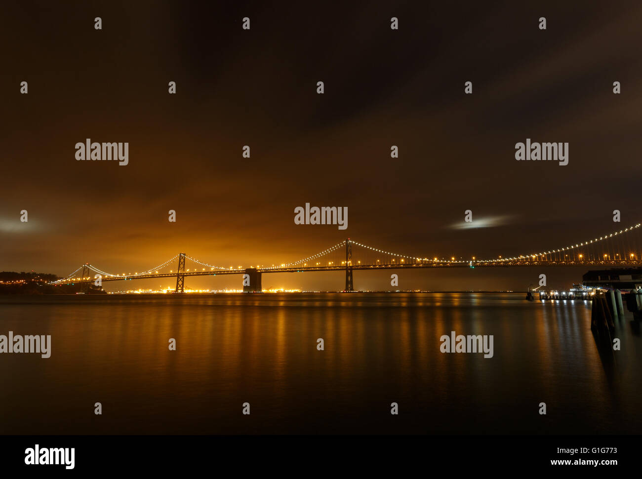 San Francisco Bay bridge lights and reflection Stock Photo Alamy