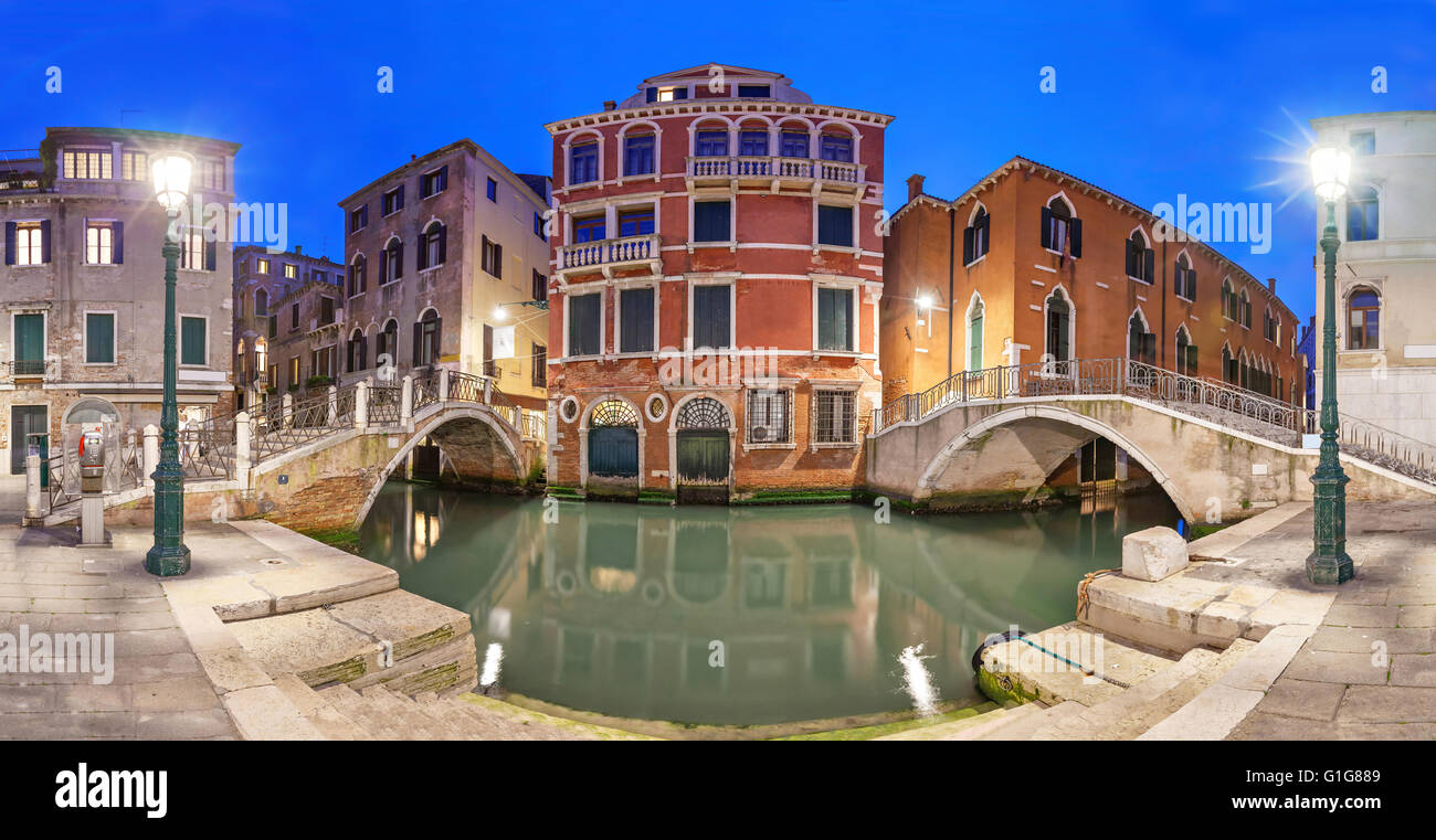 View on two bridges and red mansion in the evening from piazza Manin square, Venice, Italy Stock Photo