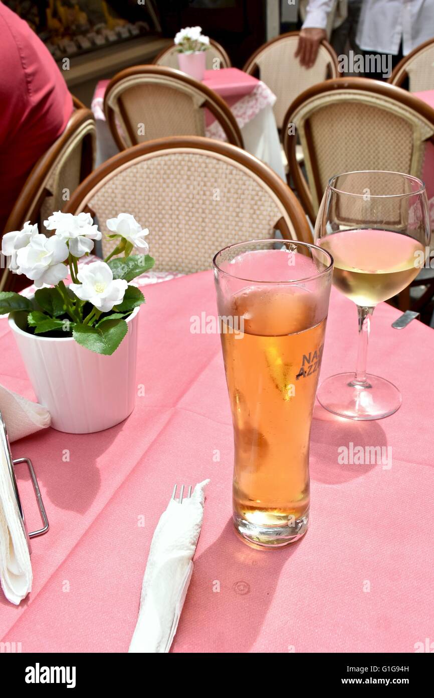 A nice glass of wine and beer on a table Stock Photo