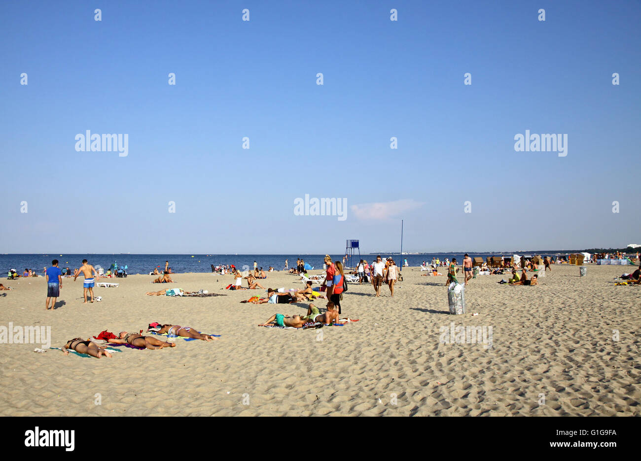 SOPOT, POLAND - JULY 26, 2012: People sunbathing at the beach in Sopot city, Baltic sea, Poland Stock Photo